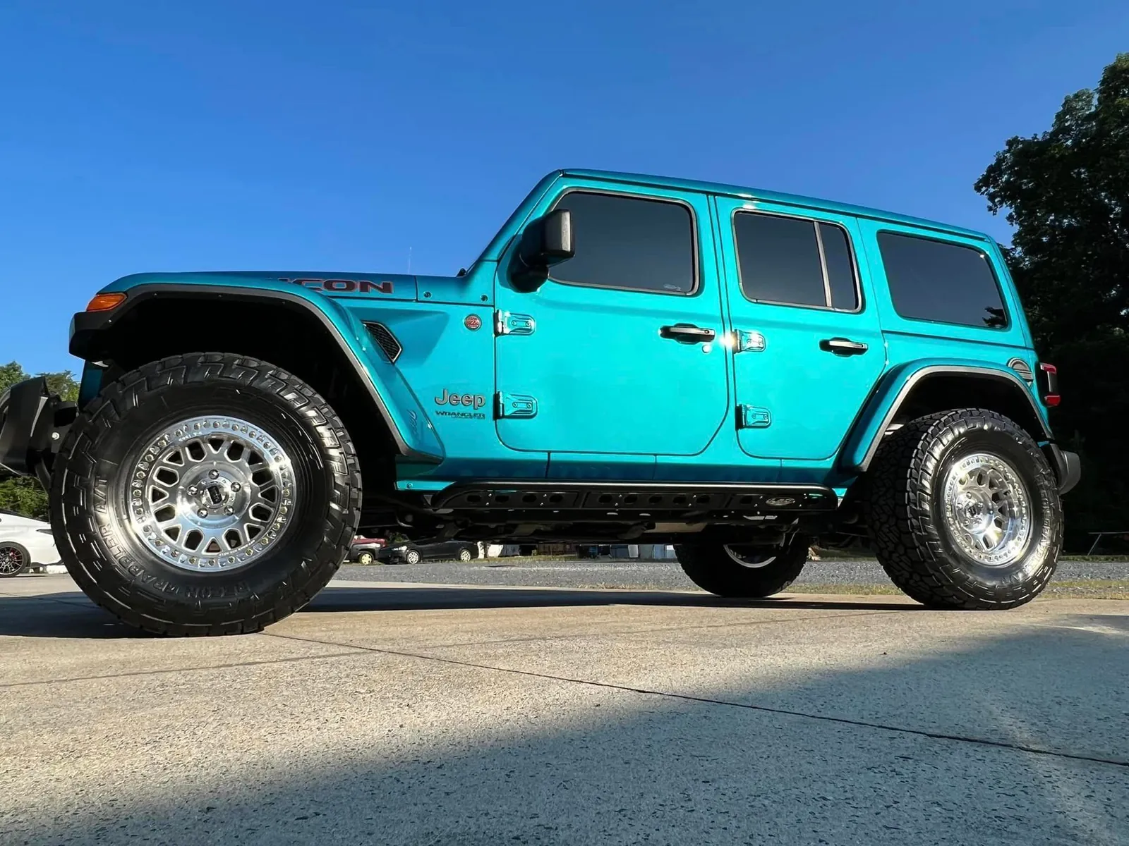 Teal Jeep Wrangler Rubicon outside the Petty Shine shop after a detail