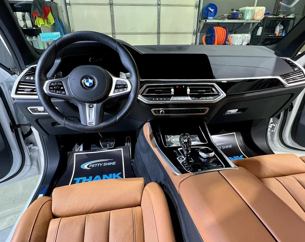 Tan leather interior of a BMW X5 M after an interior detail at Petty Shine