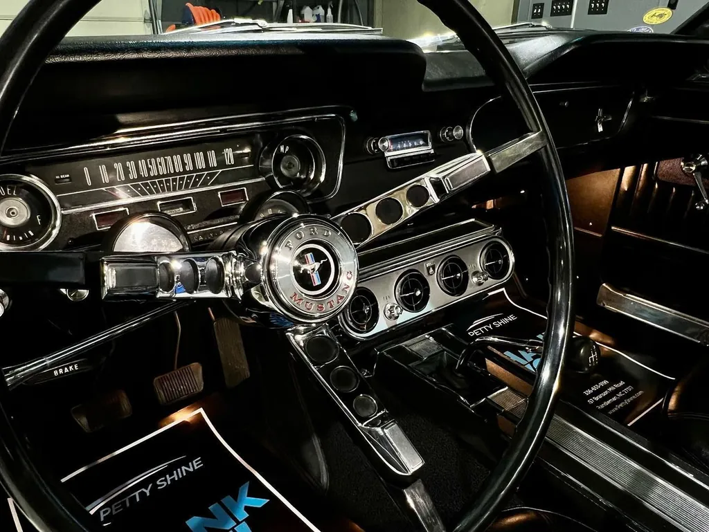 Ford Mustang dashboard and steering wheel after an interior detail at Petty Shine